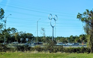Mickey Pylon A power pylon carrying high voltage lines. The pylon is in the shape of Mickey Mouse's head with two smaller circles on top of a larger one.
